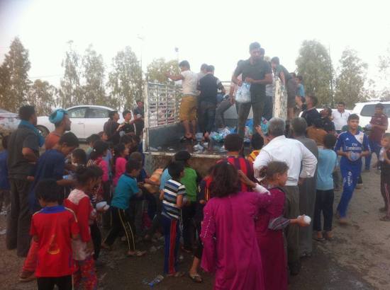Turkmen refugee children water