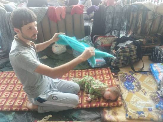Turkmen refugee father and baby